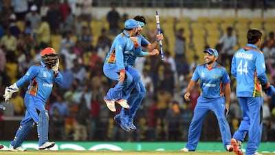 Afghanistan's players celebrate after winning the World T20 match against West Indies on Sunday. Punit Paranjpe / AFP / March 27, 2016