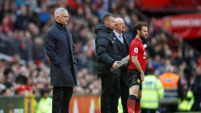 Manchester United manager Jose Mourinho, left, prepares to bring on substitute Juan Mata after seeing his side go 2-0 down to Newcastle United at Old Trafford. Reuters