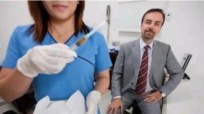 Dr Parviz Rashvand, right, of Dubai’s Synergy Medical Clinic. Jaime Puebla / The National