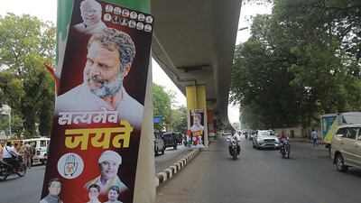 Posters of Rahul Gandhi, reading 'truth alone triumphs', line the route to the court in Surat, India, last month during his trial. EPA