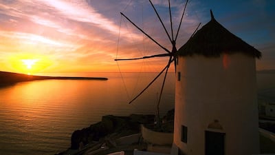 1. A view of the windmills in the island of Santorini in Greece. EPA