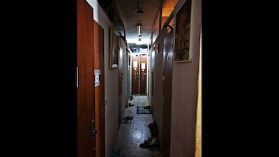 Behind the hallway doors are bed-spaces, some only big enough for one bunk bed of two single mattresses and a small dresser.