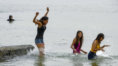 The Mediterranean at La Goulette (Halq al-Wadi) offers some respite for these girls.