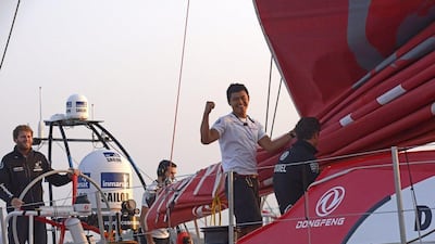 Chinese sailor Liu Xue pumps his fist as he arrives at his home port of Sanya, China with Dongfeng Race Team winners of Leg 3 of the Volvo Ocean Race on Tuesday. Rick Tomlinson /Volvo Ocean Race / Getty Images / January 27, 2015
