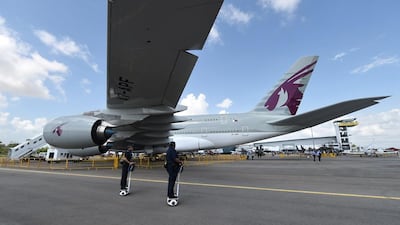 A Qatar Airways Airbus A380 aircraft is on static display during the Singapore Airshow. Roslan Rahman / AFP