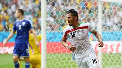 Reza Ghoochannejhad of Iran celebrates scoring his team's first goal against Bosnia at the 2014 World Cup in Salvador, Brazil. Jamie McDonald / Getty Images