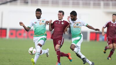 Damian Diaz, centre, of Al Wahda tries to break through the Emirates defence during their Arabian Gulf League match at Al Nahyan Stadium in Abu Dhabi on February 8, 2015. Mostafa Reda / Al Ittihad
