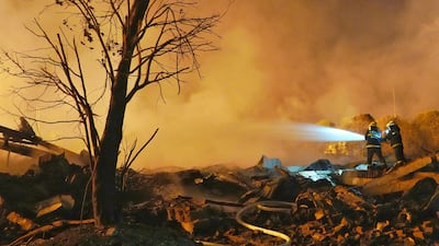 Firefighters work to extinguish a fire following a deadly blast at a fireworks factory in Liuyang, Hunan province, China. Reuters