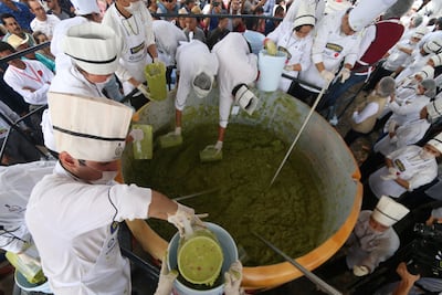 Volunteers from a culinary school mix mashed avocados. Fernando Carranza / Reuters