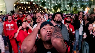 San Francisco 49ers fans react during overtime play while watching a telecast of NFL football's Super Bowl 58 on a screen outside the Chase Center in San Francisco. AP