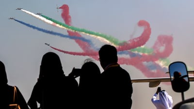 Members of Al Fursan aerobatics demonstration team of the UAE perform during the Abu Dhabi Air Expo 2022 at Al Bateen Executive Airport. EPA