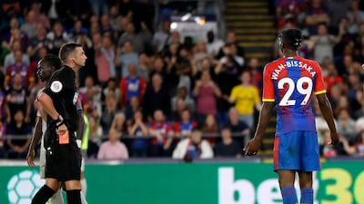 Aaron Wan-Bissaka, recieves a red card fro his foul on Mohamed Salah. AP Photo