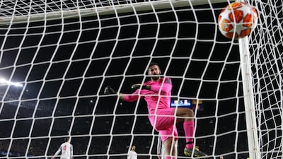 Liverpool keeper Alisson kicks the ball in frustration after Lionel Messi's goal. Catherine Ivill / Getty Images