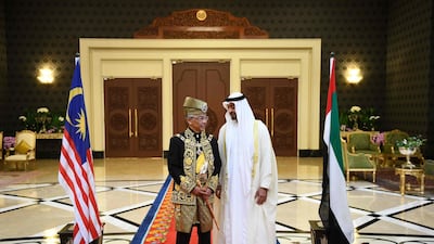 Malaysia's King Abdullah talks to Sheikh Mohamed bin Zayed. AFP