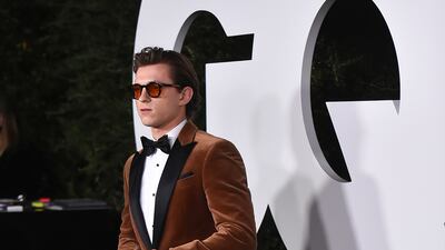 Tom Holland, in a brown velvet Boss tuxedo, attends the 2021 GQ Men of the Year Party on November 18, 2021 in West Hollywood. AP