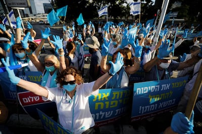 Israelis protest against their government's planned annexation of large sections of the occupied West Bank, outside government offices in Tel Aviv, Israel on June 18, 2020. Reuters