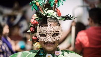 A young Hindu devotee looks on during a street parade as part of the preparations of the Diwali Hindu festival (Festival of Lights). AFP