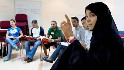 Communication Officer with the National Rehabilitation Centre Shaima Al Jabry, right, trains physical education teachers how to teach children about the dangers of drugs, smoking and alcohol. Christopher Pike / The National