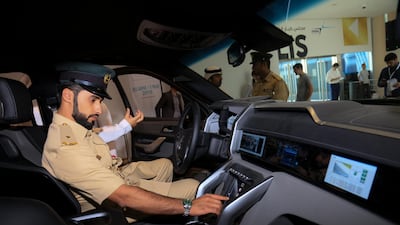 A policeman takes to the driving seat of the Beast Patrol at Gitex. W Motors