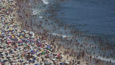 Thousands of beach goers pack Ipanema beach in Rio de Janeiro, Brazil. With temperatures reaching over 40 degrees Celsius, Rio beaches were packed on the last weekend of the year. Felipe Dana /AP