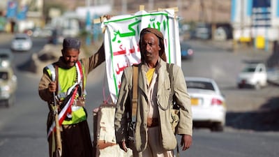 Armed Yemeni Shiite Houthi rebels man a checkpoint in the capital Sanaa on September 23, 2014. Yemeni President Abdrabuh Mansur Hadi warned of "civil war" in the Sunni-majority country as Shiite rebels were seen to be in near-total control of the capital. Mohammed Huwais/AFP Photo
