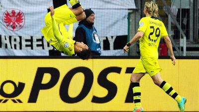 Dortmund's Pierre-Emerick Aubameyang does a backflip after scoring on Tuesday. Daniel Reinhardt / EPA