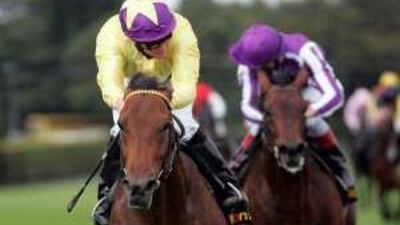 Sea The Stars, left, ridden by Mick Kinane wins the Tattersalls Millions Irish Champion Stakes during the Irish Champion Stakes Day at Leopardstown Racecourse, Dublin.