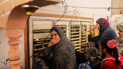 Relatives of Jamal Muslih, who died after being wounded by Israeli fire, during his funeral in central Gaza city on December 30, 2017. Mahmud Hams / AFP