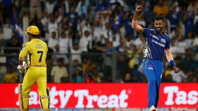 Mumbai Indians all-rounder Hardik Pandya, right, celebrates the dismissal of Chennai Super Kings captain MS Dhoni. Rafiq Maqbool / AP Photo