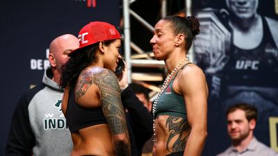 Amanda Nunes, left, and Germaine De Randamie face off