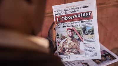 A picture of Paul-Henri Sandaogo Damiba, reported to be the leader of the mutiny, appears on a newspaper in Ouagadougou, Burkina Faso, on Tuesday. President Roch Marc Christian Kabore has been removed in a coup in the West African country. AFP