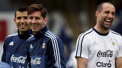 Lionel Messi, centre, in Argentina training alongside Manchester City duo Sergio Ageuro, left, and Pablo Zabaleta. Marcos Brindicci / Reuters / June 25, 2015