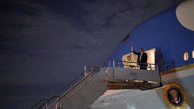 US President Donald Trump steps off Air Force One upon arrival at Miami International Airport in Miami, Florida. AFP
