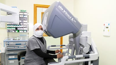 Gynaecologist Dr Mona Kashwani is the first female Emirati doctor to perform an operation using a robotic surgery system, pictured, at Al Qassimi hospital in Sharjah. All photos: Pawan Singh / The National