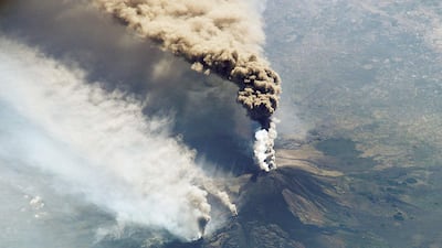 SICILY, ITALY - OCTOBER 30: (FILE IMAGE) This image, taken from cameras onboard the International Space Station, shows plumes of smoke and ash erupting from Mount Etna on October 30, 2002 in Sicily, Italy. The image looks as if it were taken by a high altitude aircraft, but in fact it was taken with a high magnification lens from space. (Photo by ISS/NASA/Getty Images)