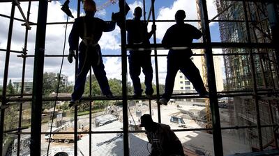 Kenya casual labourers work at a construction site in Nairobi. Kenyan contractors are losing out to Chinese firms that are grabbing lucrative construction tenders for private projects as they diversify from public infrastructure deals. Simon Maina / AFP