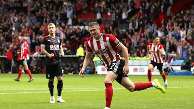 John Lundstram wheels away in celebration after scoring for Sheffield United against Crystal Palace. Getty Images