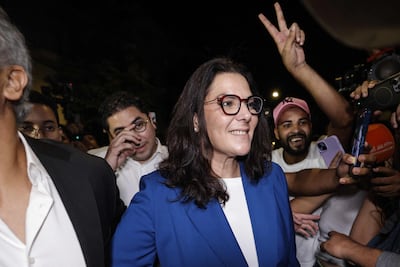 Fatima Ezzahra El Mansouri of Morocco's PAM arrives to celebrate with party members after the provisional election results. AFP