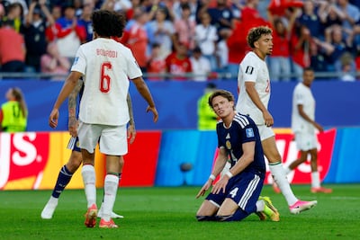 Scotland midfielder Scott McTominay, centre, reacts after a missed shot on goal. EPA