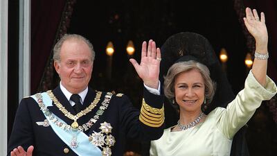 A 2004 image of Juan Carlos of Spain and his wife Queen Sofia of Spain on the balcony of the Oriental Palace in Madrid. AFP