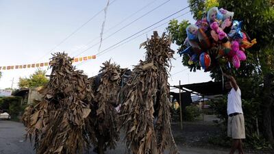 The villagers were elated and they rolled in the mud, he said, and have carried on that tradition ever since. Ritchie B Tong / EPA