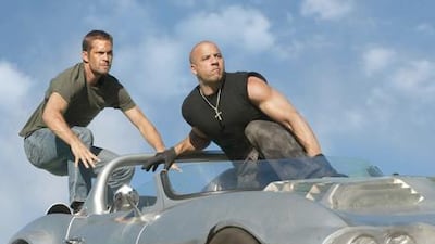 Paul Walker, left, as Brian O'Conner and Vin Diesel as Dominic Toretto in Fast Five.