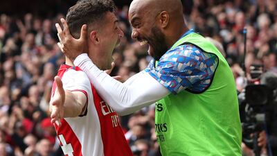 Granit Xhaka celebrates scoring the third goal with Alexandre Lacazette. Action Images