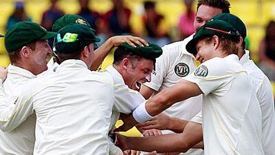 Australia's Michael Hussey celebrates with teammates after the dismissal of key threat, Mahela Jayawardena.
