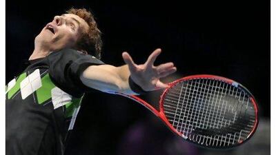 Andy Murray serves on his way to victory over Robin Soderling in London yesterday.