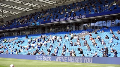 File photo dated 29-08-2020 of Brighton and Hove Albion fans take their seats in the stands with social distancing measures before the pre-season friendly at the AMEX Stadium in Brighton PA Photo. Issue date: Monday November 23, 2020. Outdoor and indoor sports venues in tiers 1 and 2 will be able to welcome a “limited number” of spectators to events when the national lockdown ends, Prime Minister Boris Johnson has said. See PA story SPORT Coronavirus. Photo credit should read Adam Davy/PA Wire.