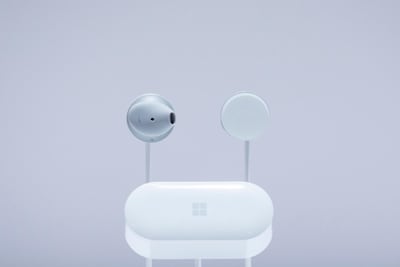Microsoft Surface Earbuds and a case are displayed in New York. Microsoft Corp earlier this month. AP Photo / Mark Lennihan