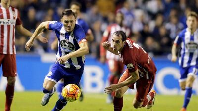 Deportivo Coruna's Lucas Perez, left, scored the equaliser that earned the home side a draw. Miguel Vidal / Reuters