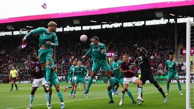 Liverpool captain Virgil van Dijk heads the ball clear. Getty Images