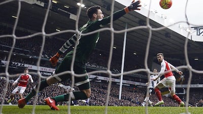 Football Soccer - Tottenham Hotspur v Arsenal - Barclays Premier League - White Hart Lane - 5/3/16Aaron Ramsey scores the first goal for ArsenalReuters / Dylan MartinezLivepicEDITORIAL USE ONLY. No use with unauthorized audio, video, data, fixture lists, club/league logos or "live" services. Online in-match use limited to 45 images, no video emulation. No use in betting, games or single club/league/player publications. Please contact your account representative for further details.